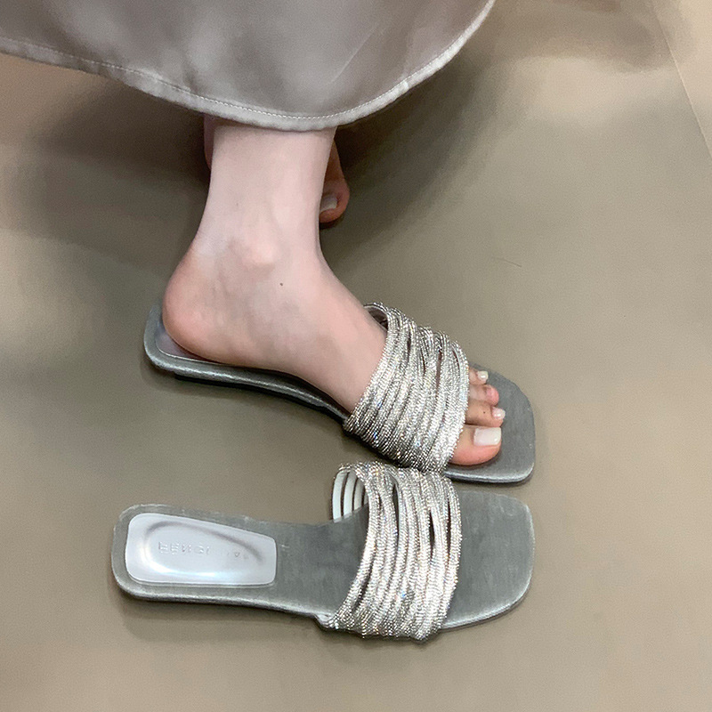 Fashionable one-piece slippers for women in summer, worn by lazy people, with rhinestones and low heels, exposed toes, and a sense of luxury Fashionable one-piece slippers for women in summer, worn by lazy people, with rhinestones and low heels, exposed toes, and a sense of luxury
