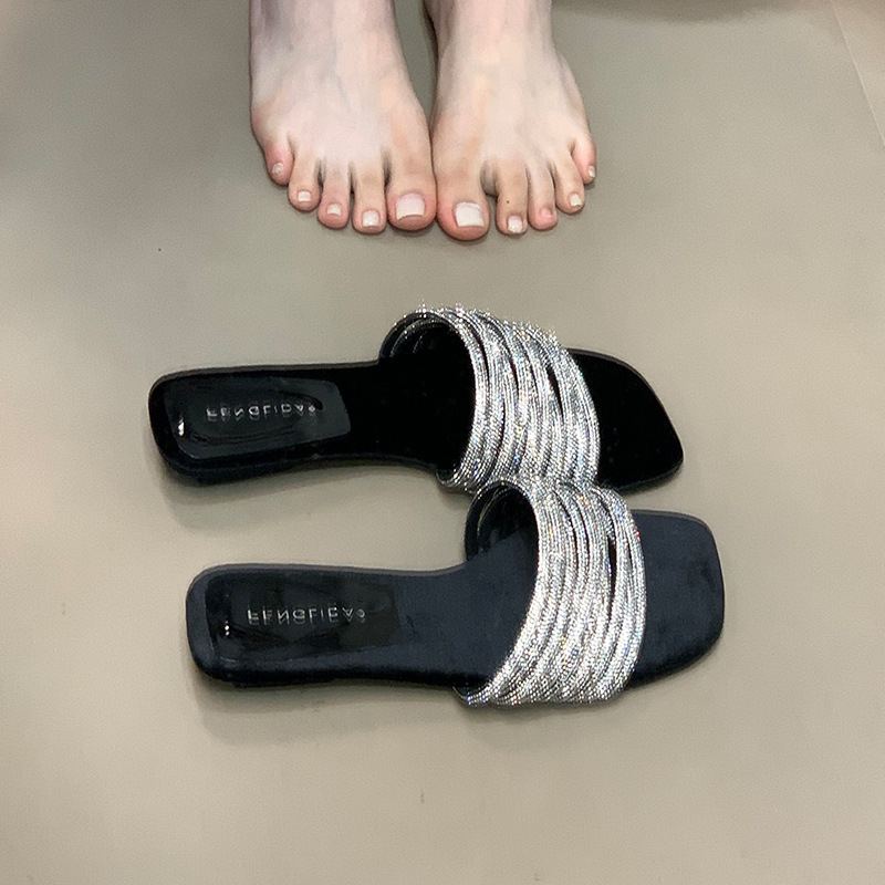 Fashionable one-piece slippers for women in summer, worn by lazy people, with rhinestones and low heels, exposed toes, and a sense of luxury Fashionable one-piece slippers for women in summer, worn by lazy people, with rhinestones and low heels, exposed toes, and a sense of luxury